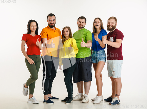 Image of Young people weared in LGBT flag colors isolated on white background, LGBT pride concept