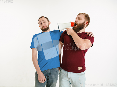 Image of Young men weared in LGBT flag colors isolated on white background, LGBT pride concept