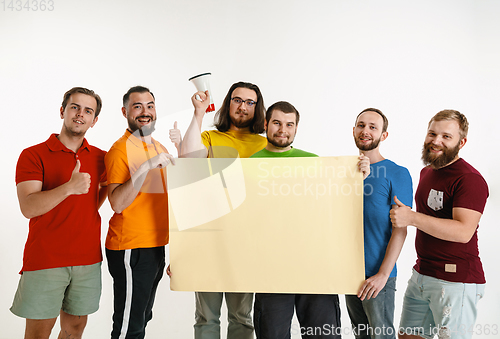 Image of Young men weared in LGBT flag colors isolated on white background, LGBT pride concept