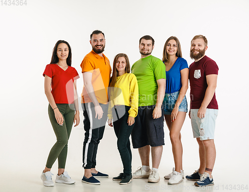 Image of Young people weared in LGBT flag colors isolated on white background, LGBT pride concept