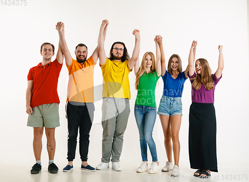 Image of Young people weared in LGBT flag colors isolated on white background, LGBT pride concept