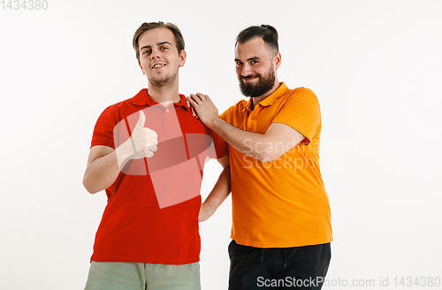 Image of Young men weared in LGBT flag colors isolated on white background, LGBT pride concept