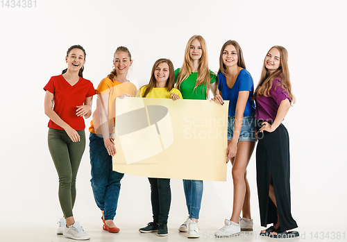 Image of Young people weared in LGBT flag colors isolated on white background, LGBT pride concept