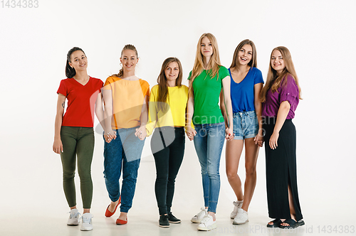 Image of Young people weared in LGBT flag colors isolated on white background, LGBT pride concept