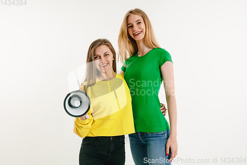 Image of Young women weared in LGBT flag colors isolated on white background, LGBT pride concept