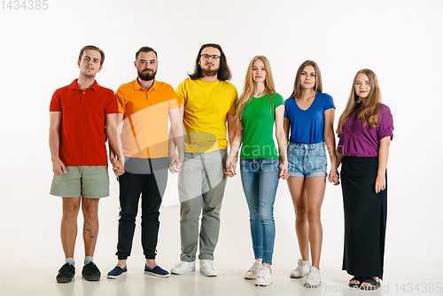 Image of Young people weared in LGBT flag colors isolated on white background, LGBT pride concept