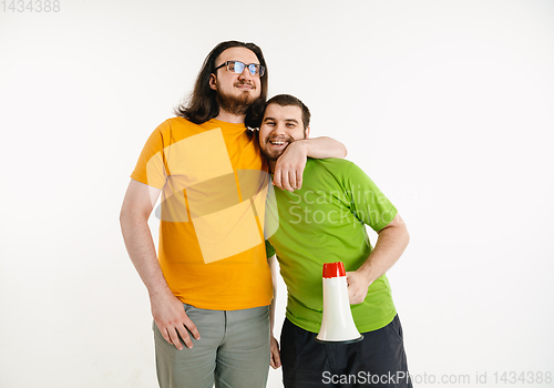 Image of Young men weared in LGBT flag colors isolated on white background, LGBT pride concept