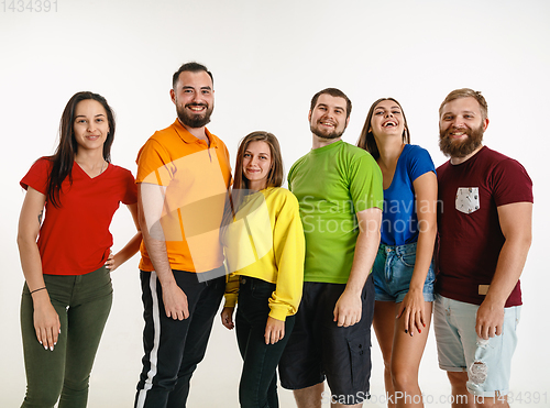 Image of Young people weared in LGBT flag colors isolated on white background, LGBT pride concept