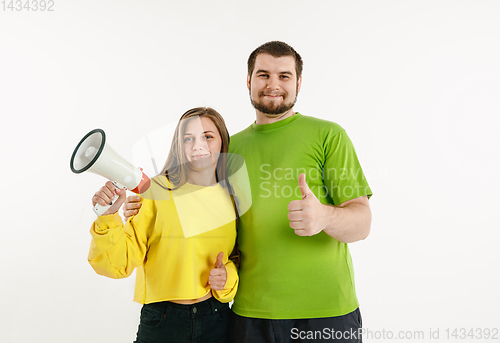 Image of Young men weared in LGBT flag colors isolated on white background, LGBT pride concept