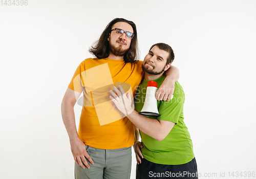 Image of Young men weared in LGBT flag colors isolated on white background, LGBT pride concept