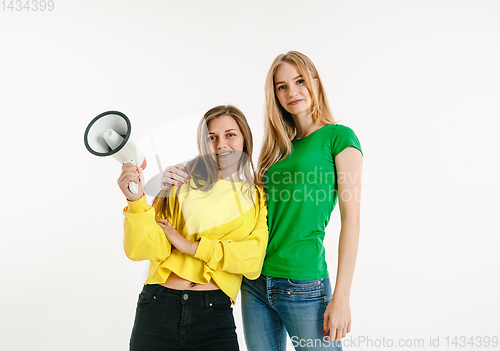 Image of Young women weared in LGBT flag colors isolated on white background, LGBT pride concept