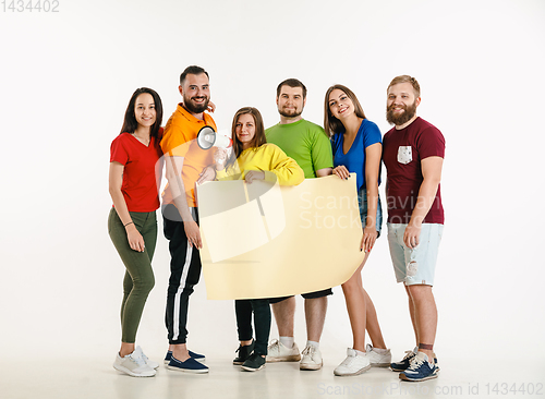 Image of Young people weared in LGBT flag colors isolated on white background, LGBT pride concept