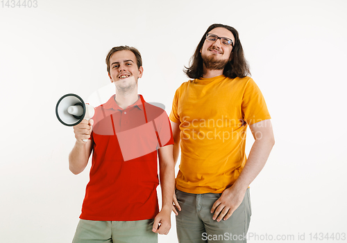 Image of Young men weared in LGBT flag colors isolated on white background, LGBT pride concept