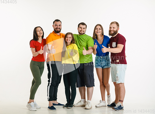 Image of Young people weared in LGBT flag colors isolated on white background, LGBT pride concept