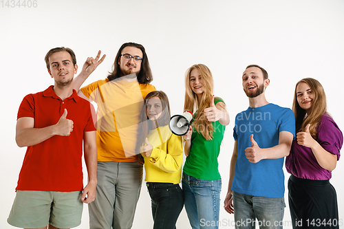 Image of Young people weared in LGBT flag colors isolated on white background, LGBT pride concept