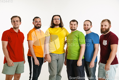 Image of Young men weared in LGBT flag colors isolated on white background, LGBT pride concept