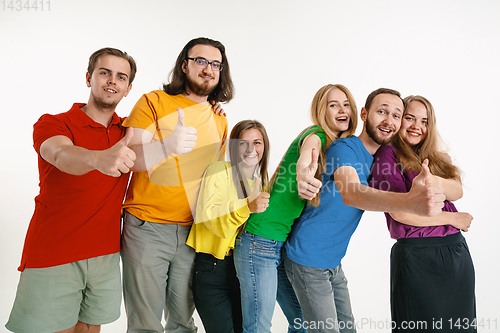 Image of Young people weared in LGBT flag colors isolated on white background, LGBT pride concept