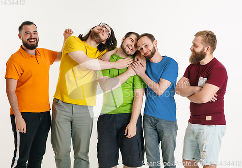 Image of Young men weared in LGBT flag colors isolated on white background, LGBT pride concept