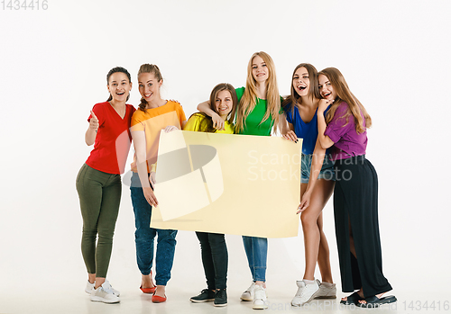 Image of Young people weared in LGBT flag colors isolated on white background, LGBT pride concept