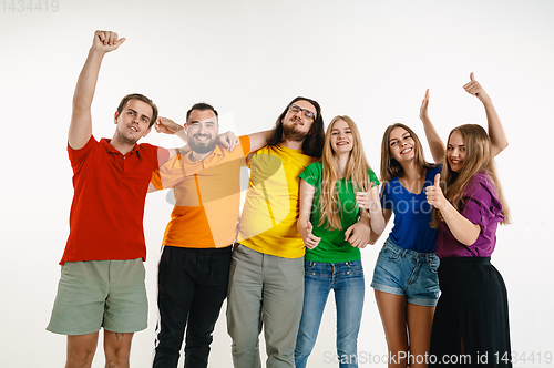 Image of Young people weared in LGBT flag colors isolated on white background, LGBT pride concept