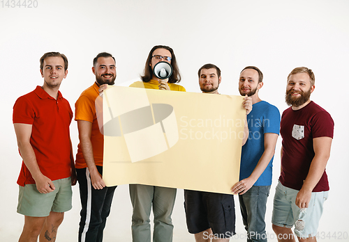 Image of Young men weared in LGBT flag colors isolated on white background, LGBT pride concept