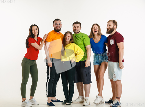 Image of Young people weared in LGBT flag colors isolated on white background, LGBT pride concept