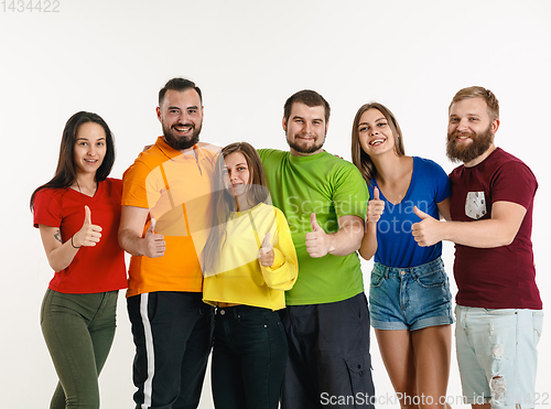 Image of Young people weared in LGBT flag colors isolated on white background, LGBT pride concept