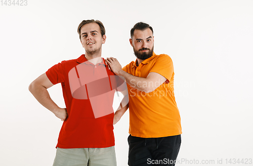 Image of Young men weared in LGBT flag colors isolated on white background, LGBT pride concept