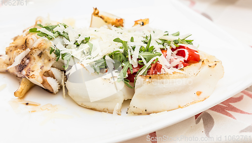 Image of Cuttlefish with tomato, salad and Parmigiano cheese