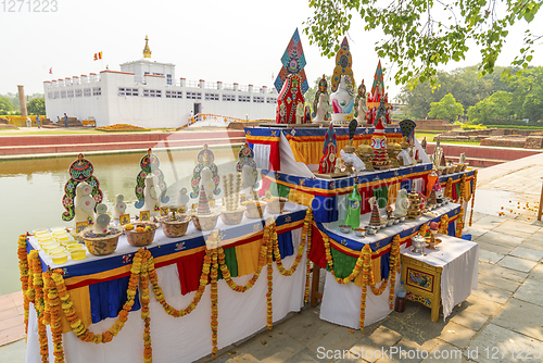 Image of Buddha birthplace in Lumbini and buddhist offerings