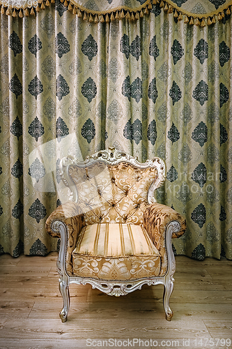 Image of Old armchair in the room 