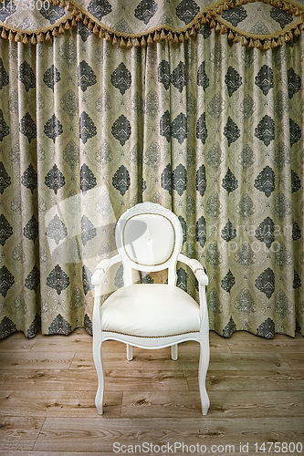 Image of Old armchair in the room 