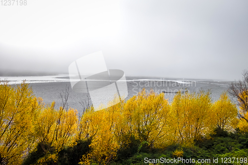 Image of Mountain river landscape in the fog. New Zealand