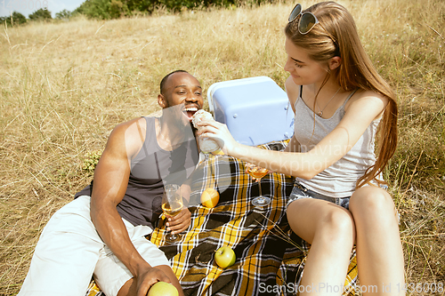 Image of Young multiethnic international couple outdoors