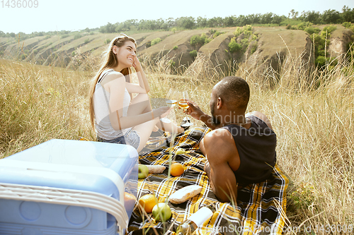 Image of Young multiethnic international couple outdoors