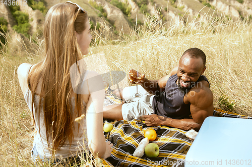 Image of Young multiethnic international couple outdoors