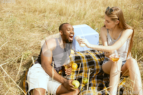 Image of Young multiethnic international couple outdoors