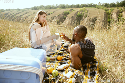 Image of Young multiethnic international couple outdoors