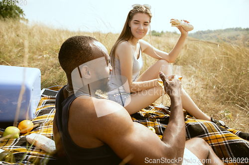 Image of Young multiethnic international couple outdoors