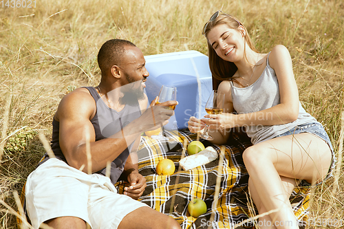 Image of Young multiethnic international couple outdoors