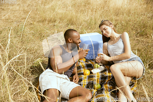 Image of Young multiethnic international couple outdoors