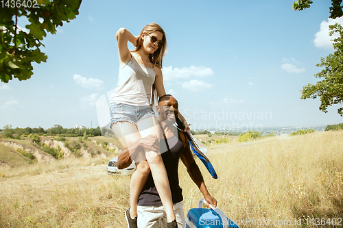 Image of Young multiethnic international couple outdoors