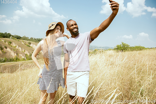 Image of Young multiethnic international couple outdoors