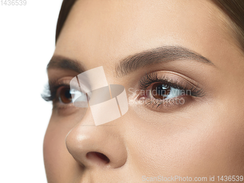 Image of Close up portrait of beautiful young woman face on white studio background