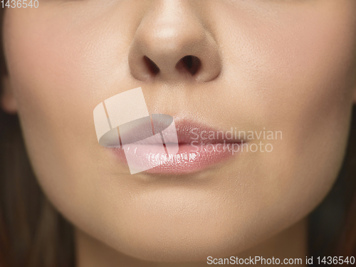 Image of Close up portrait of beautiful young woman face on white studio background