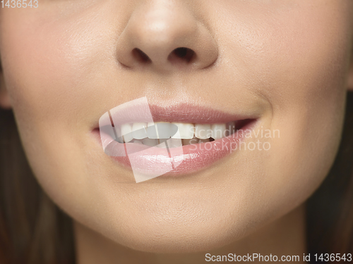 Image of Close up portrait of beautiful young woman face on white studio background