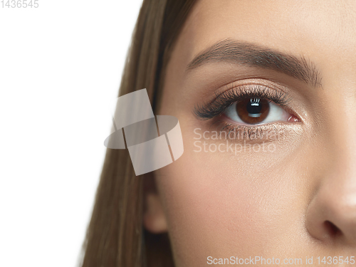 Image of Close up portrait of beautiful young woman face on white studio background