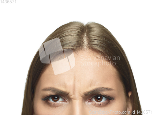 Image of Close up portrait of beautiful young woman face on white studio background