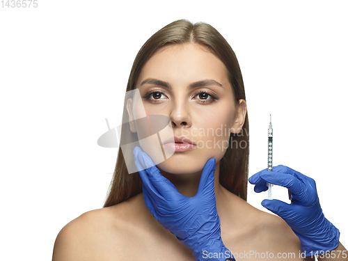 Image of Portrait of beautiful young woman isolated on white studio background