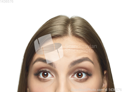 Image of Close up portrait of beautiful young woman face on white studio background